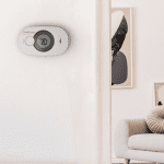 FireAngel digital display CO alarm fitted to wall inside house.