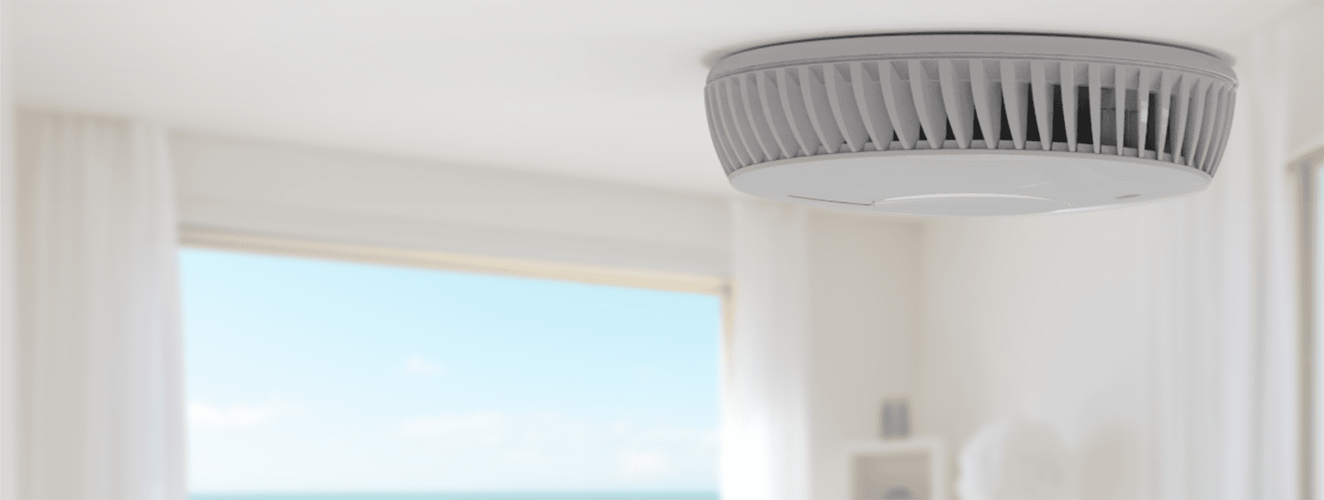 FireAngel smoke alarm affixed to a ceiling within a home.